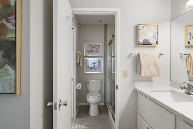 full bathroom with tile patterned flooring, a shower stall, vanity, baseboards, and toilet
