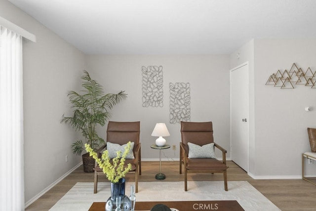 48668 Desert Flower Dr, Palm Desert, CA 92260 - living area featuring wood finished floors and baseboards