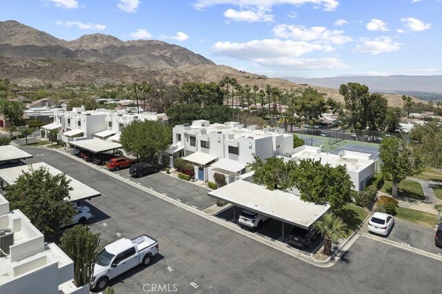 birds eye view of property featuring a mountain view and a residential view