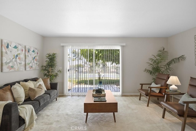 living area featuring light colored carpet