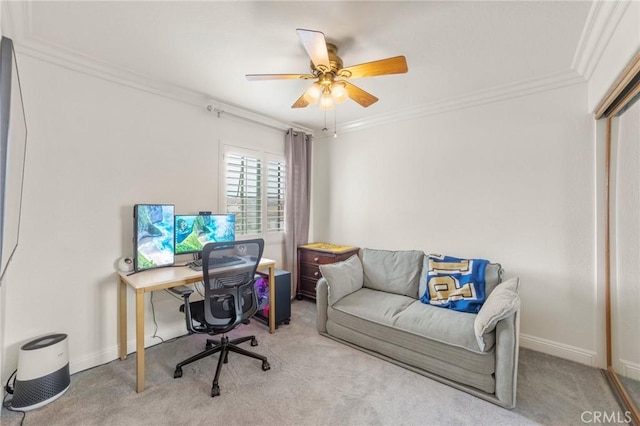 office area with crown molding, carpet floors, and a ceiling fan