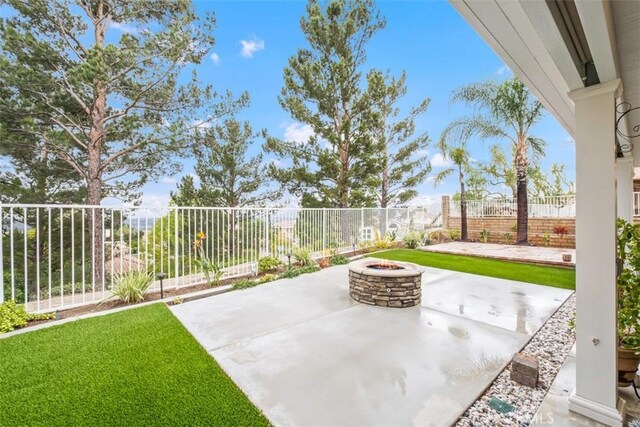 534 S Laureltree Dr, Anaheim Hills, CA 92808 - view of patio / terrace with an outdoor fire pit and a fenced backyard