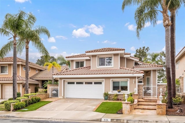 534 S Laureltree Dr, Anaheim Hills, CA 92808 - view of front of property featuring a tile roof, driveway, fence, and stone siding