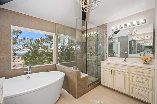 534 S Laureltree Dr, Anaheim Hills, CA 92808 - full bath with a chandelier, a stall shower, a freestanding bath, and vanity