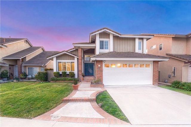 8 Burke, Irvine, CA 92620 - traditional home with driveway, a front yard, and brick siding