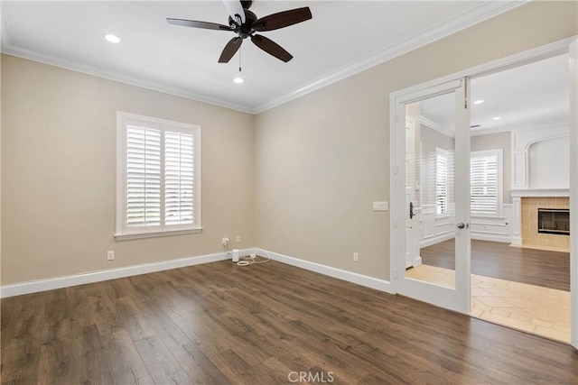 unfurnished room with recessed lighting, ornamental molding, a ceiling fan, and dark wood-style flooring
