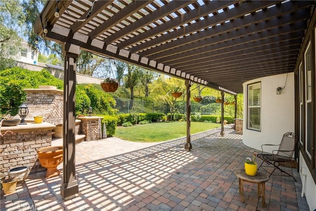 view of patio / terrace featuring fence and a pergola