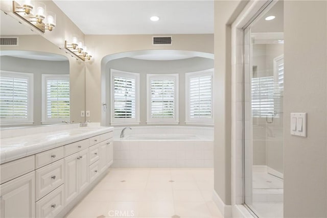 full bathroom featuring double vanity, a garden tub, visible vents, an enclosed shower, and tile patterned flooring