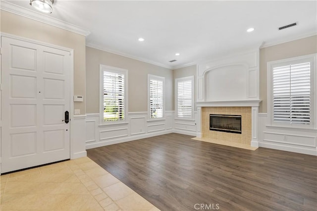 interior space featuring visible vents, recessed lighting, and a decorative wall