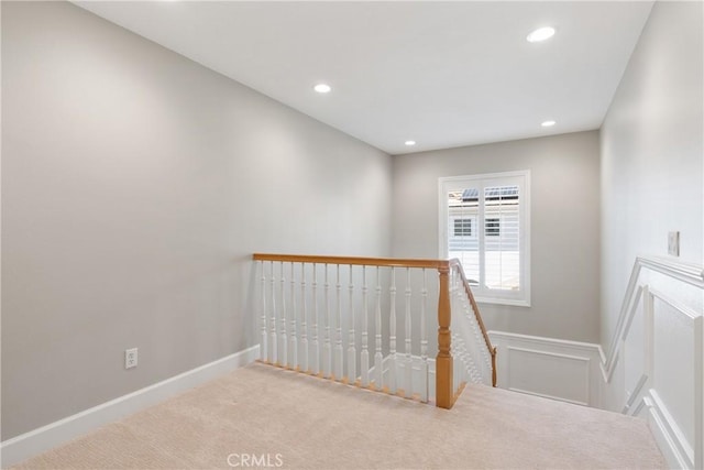 staircase with carpet floors, recessed lighting, and baseboards