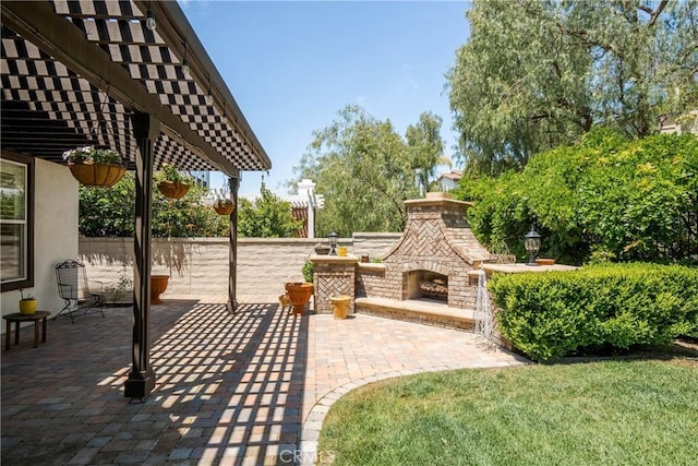 view of patio featuring a pergola and an outdoor brick fireplace