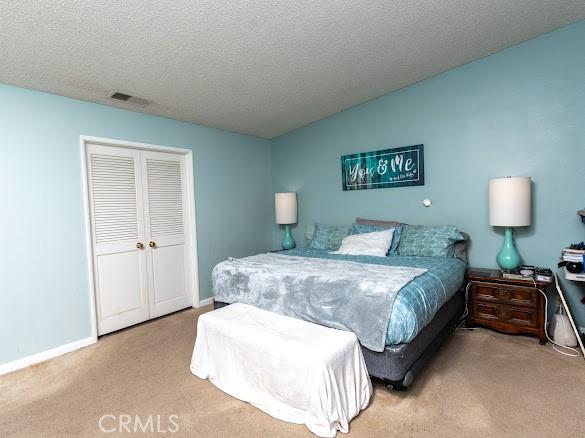 909 Shady Ln, Glendora, CA 91740 - bedroom with carpet floors, a textured ceiling, and baseboards