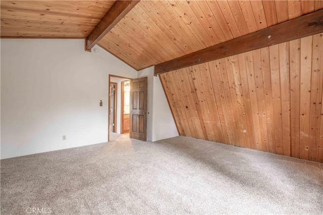 interior space featuring wooden ceiling and lofted ceiling with beams