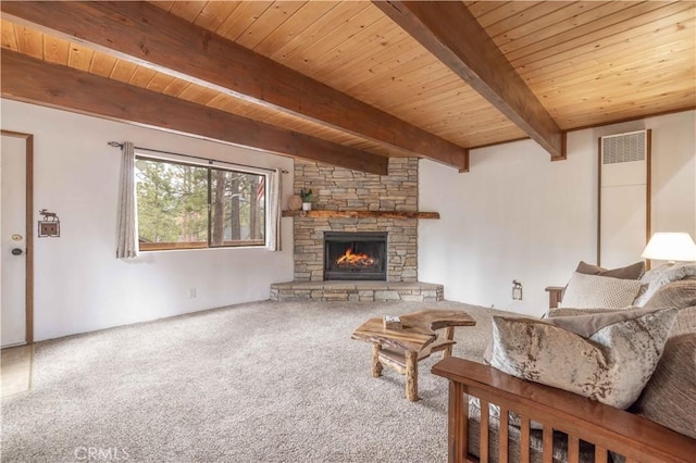 carpeted living room with wood ceiling, beamed ceiling, and a stone fireplace