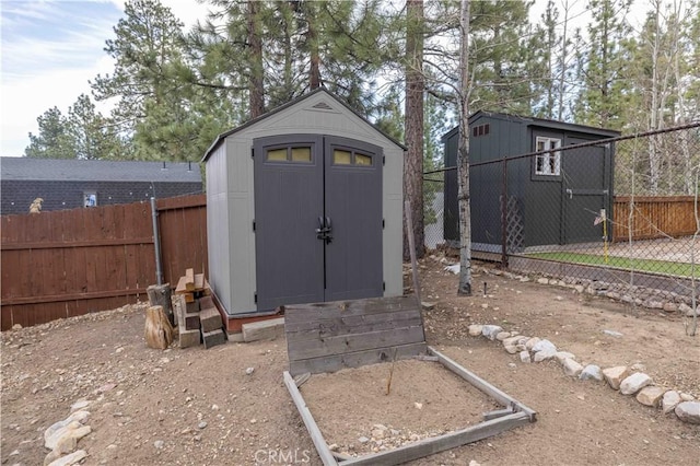 view of shed featuring a fenced backyard