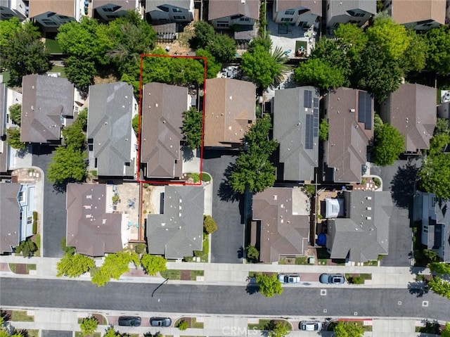 birds eye view of property with a residential view