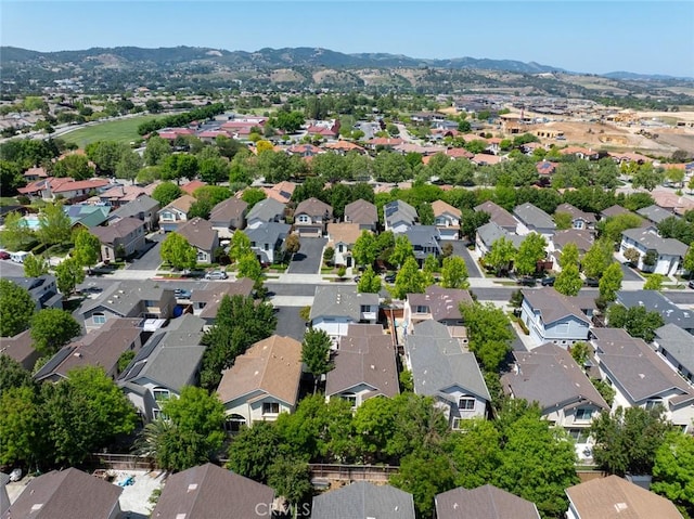drone / aerial view with a residential view and a mountain view