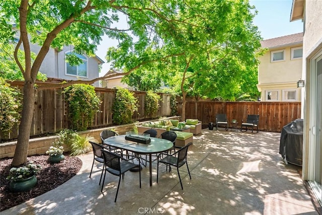 view of patio with a fenced backyard, area for grilling, and outdoor dining space