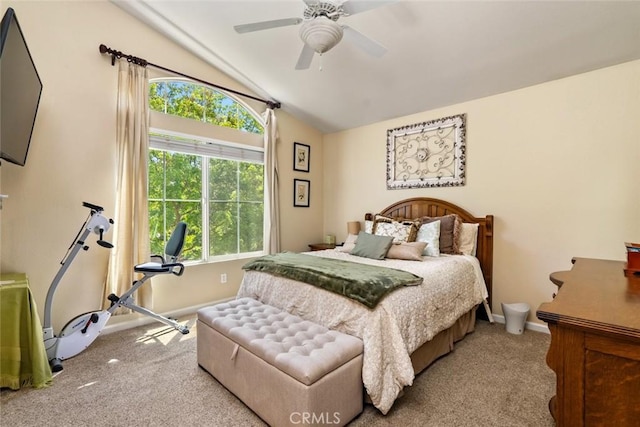 bedroom featuring carpet floors, baseboards, vaulted ceiling, and ceiling fan