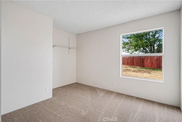 1148 Arlington Ct, Rosamond, CA 93560 - empty room featuring carpet floors and a textured ceiling