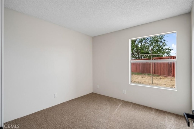 1148 Arlington Ct, Rosamond, CA 93560 - spare room featuring a textured ceiling and carpet