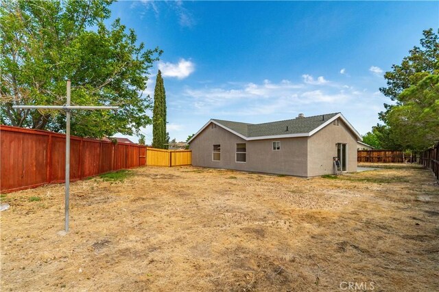 1148 Arlington Ct, Rosamond, CA 93560 - back of house with a fenced backyard