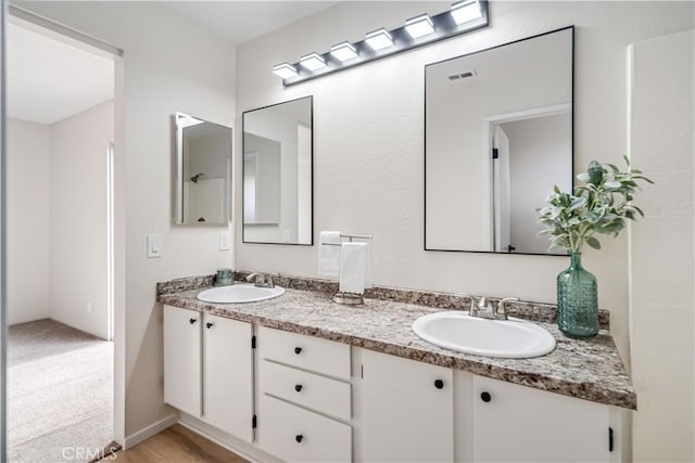 1148 Arlington Ct, Rosamond, CA 93560 - bathroom featuring a sink, double vanity, and visible vents
