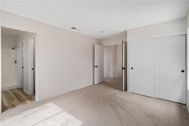 1148 Arlington Ct, Rosamond, CA 93560 - unfurnished bedroom with a closet, carpet flooring, and ensuite bath