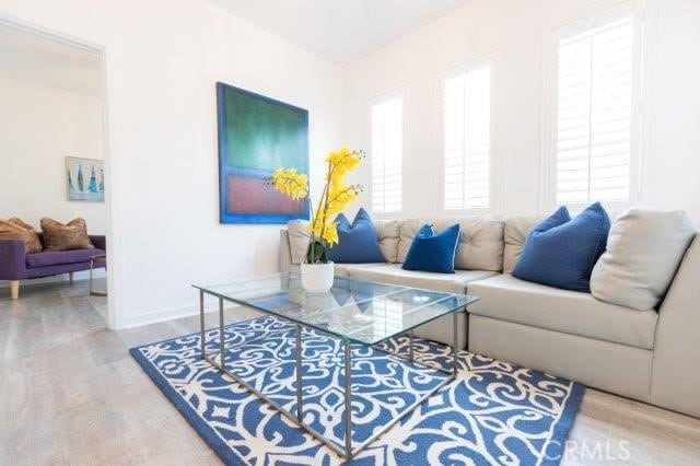 2630 Luminous Ln, Costa Mesa, CA 92626 - living area featuring wood finished floors and baseboards