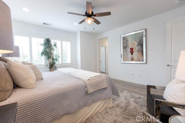 2630 Luminous Ln, Costa Mesa, CA 92626 - bedroom with wood finished floors, recessed lighting, baseboards, and ceiling fan