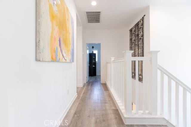2630 Luminous Ln, Costa Mesa, CA 92626 - hallway with light wood-style flooring