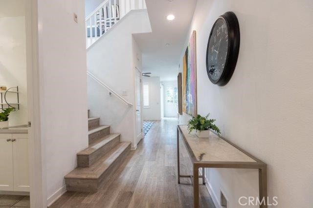 2630 Luminous Ln, Costa Mesa, CA 92626 - corridor featuring wood finished floors and stairs