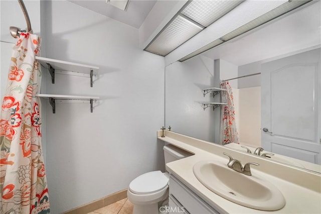 full bathroom with tile patterned flooring, curtained shower, vanity, baseboards, and toilet
