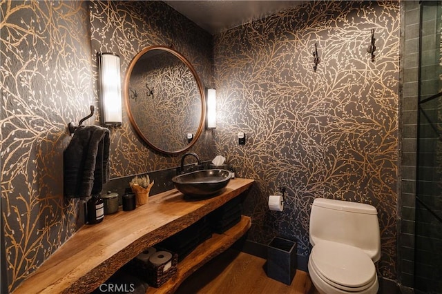 28805 N Shore Rd, Lake Arrowhead, CA 92352 - bathroom featuring vanity, wood finished floors, toilet, and wallpapered walls