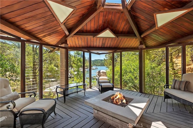 28805 N Shore Rd, Lake Arrowhead, CA 92352 - sunroom featuring a water view, beamed ceiling, and a fire pit