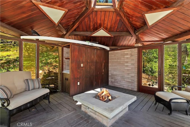 28805 N Shore Rd, Lake Arrowhead, CA 92352 - sunroom featuring plenty of natural light, a fire pit, and beamed ceiling
