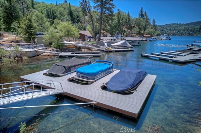 28805 N Shore Rd, Lake Arrowhead, CA 92352 - dock area featuring a water view and a wooded view