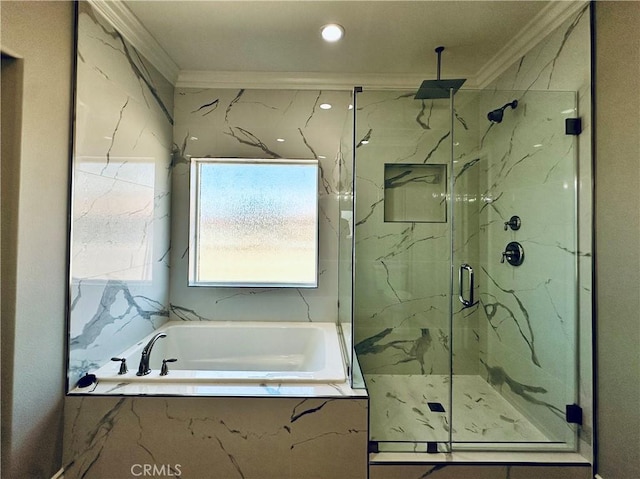 bathroom featuring a marble finish shower, ornamental molding, and a bath