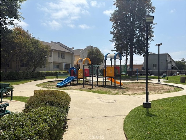 community jungle gym with a yard