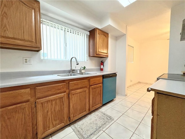 kitchen featuring a sink, dishwashing machine, brown cabinets, and light countertops