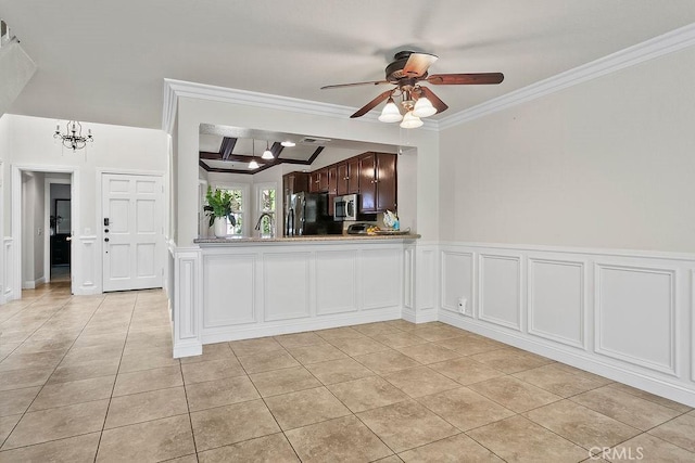 3630 S Bear St Unit 67, Santa Ana, CA 92704 - kitchen with freestanding refrigerator, a ceiling fan, light tile patterned flooring, ornamental molding, and stainless steel microwave