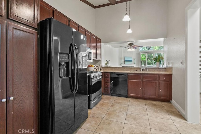 3630 S Bear St Unit 67, Santa Ana, CA 92704 - kitchen featuring black appliances, light tile patterned flooring, a ceiling fan, a high ceiling, and pendant lighting