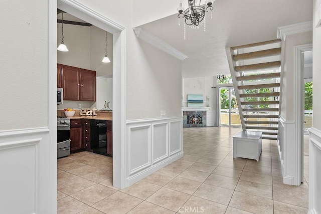 interior space featuring a decorative wall, light tile patterned flooring, and a wealth of natural light