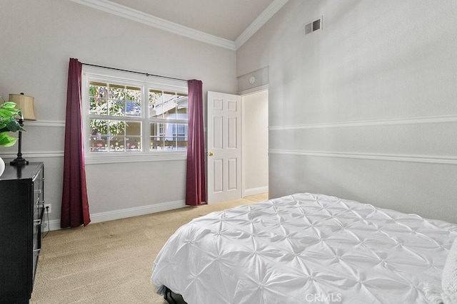 carpeted bedroom with visible vents, ornamental molding, and baseboards