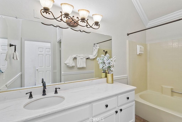bathroom with crown molding, shower / bathtub combination, a chandelier, and vanity
