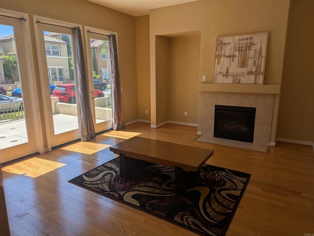 1703 Oconnor Ave, Chula Vista, CA 91913 - living area with wood finished floors, healthy amount of natural light, and a tiled fireplace