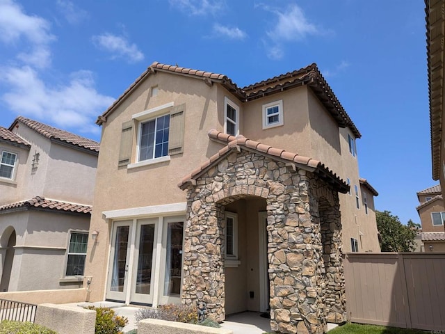 1703 Oconnor Ave, Chula Vista, CA 91913 - mediterranean / spanish-style home featuring stone siding, a tiled roof, and stucco siding