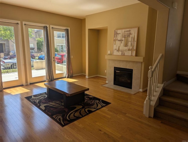 1703 Oconnor Ave, Chula Vista, CA 91913 - living area featuring healthy amount of natural light, wood finished floors, and a tiled fireplace