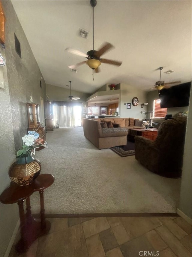 carpeted living area featuring ceiling fan, vaulted ceiling, and visible vents