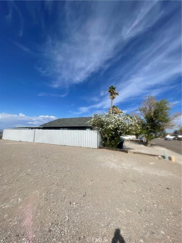 view of yard with a pole building and an outbuilding
